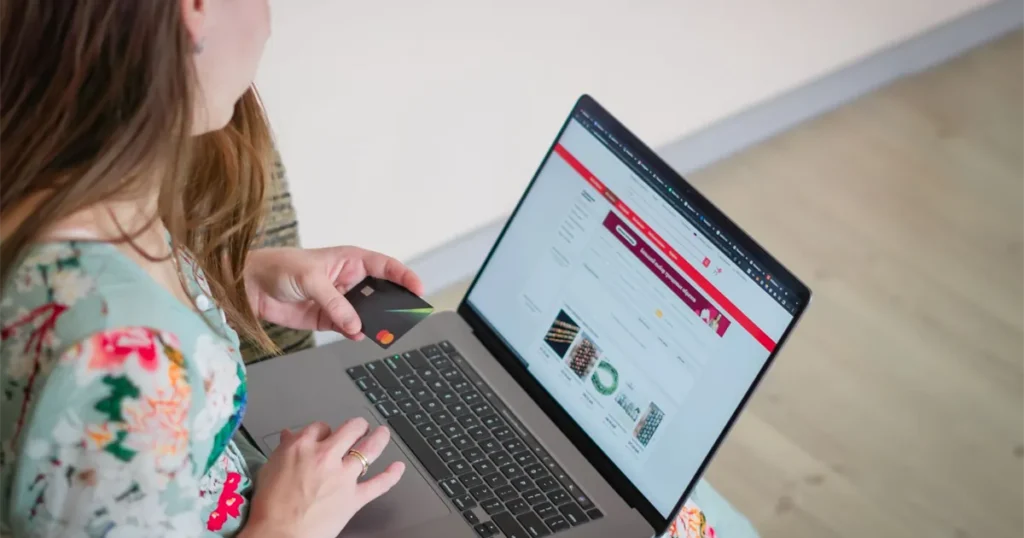Woman using one of the best secured credit cards in Canada to shop online