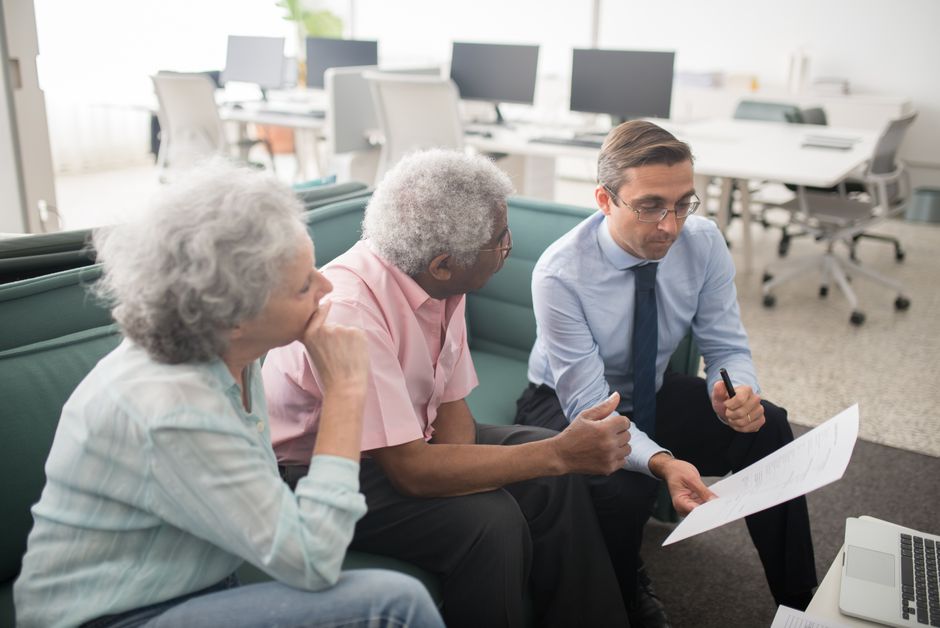 Credit specialist helping a client review a credit report in Canada