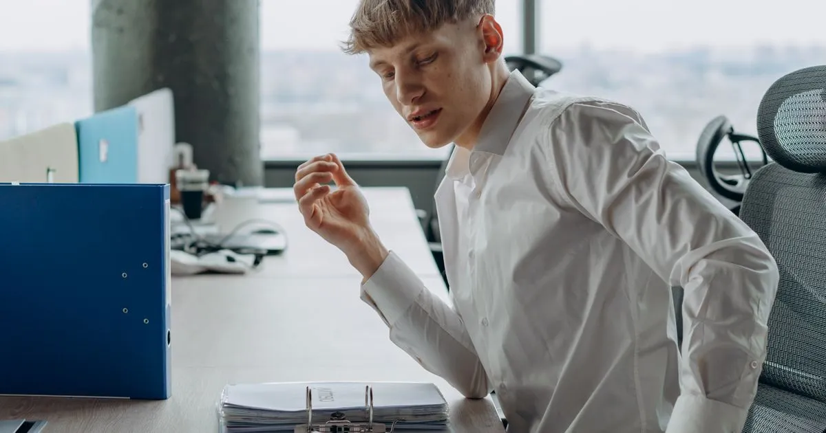 Reviewing debt management plan documents in an office