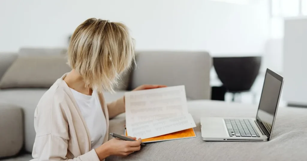 Woman reviewing her Equifax credit report to prepare an Equifax dispute in Canada