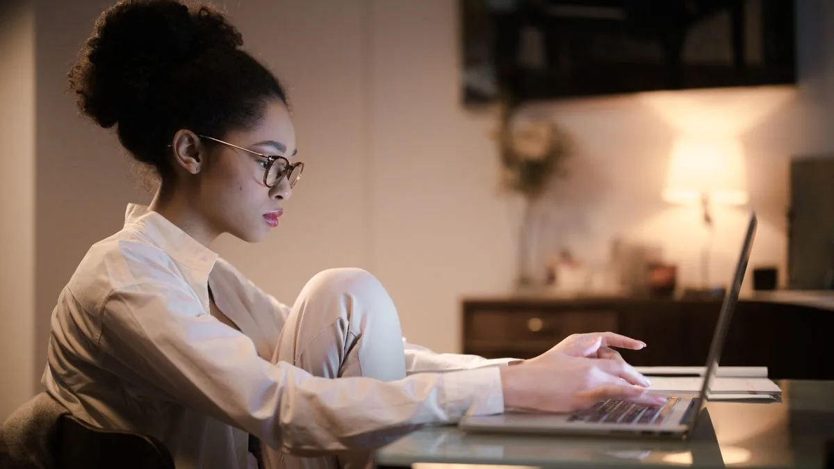 Woman filing an Equifax dispute online on her laptop at home