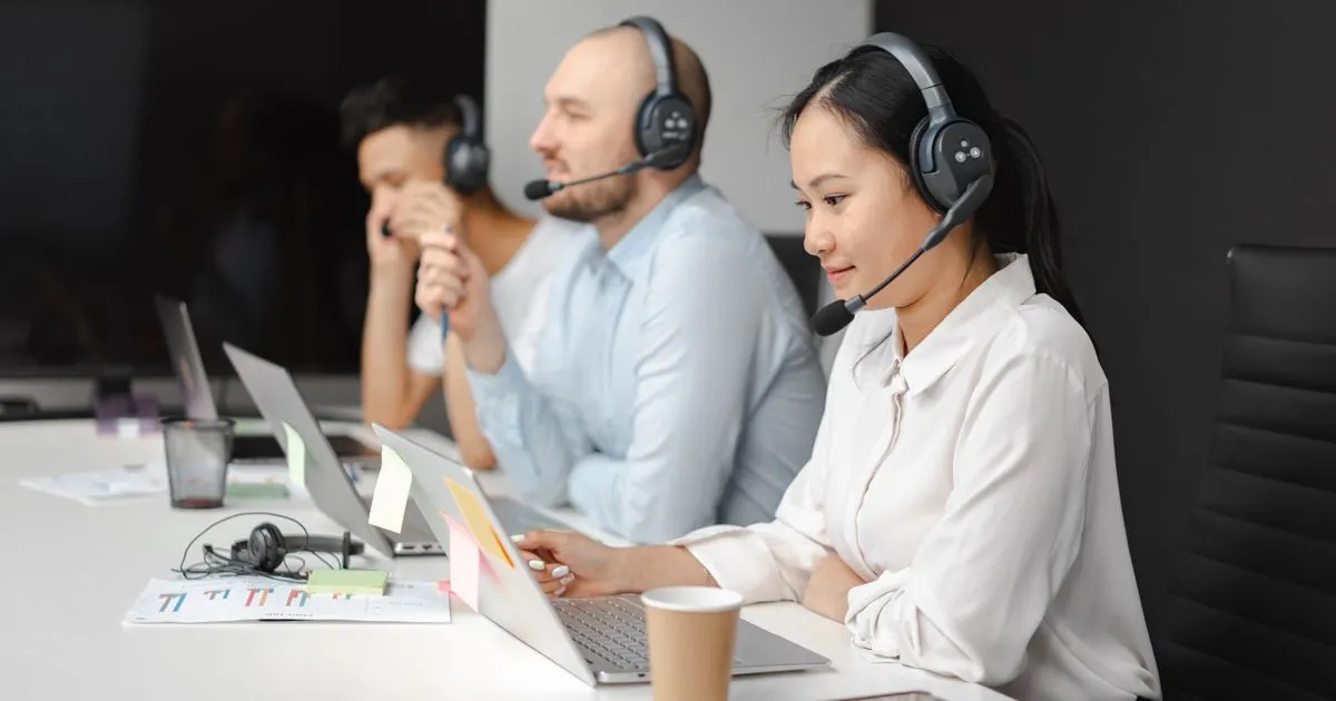 Specialists completing a free credit assessment with headsets