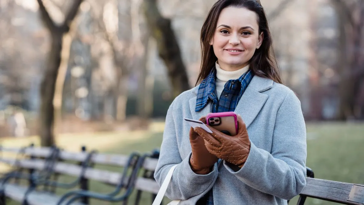 Newcomer checking her Canadian credit score while building credit for newcomers