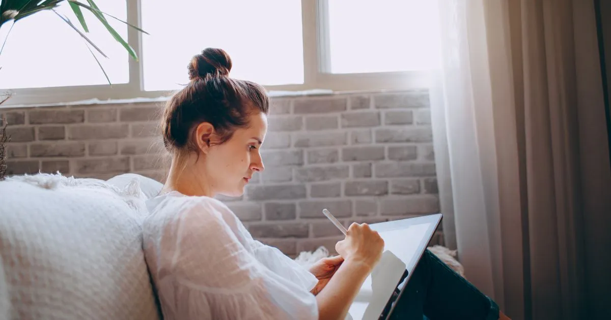 Reading the terms and conditions on a tablet at home