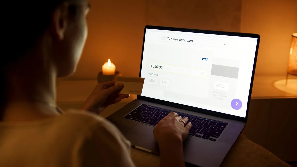 Person using a secured credit card for a safe online payment