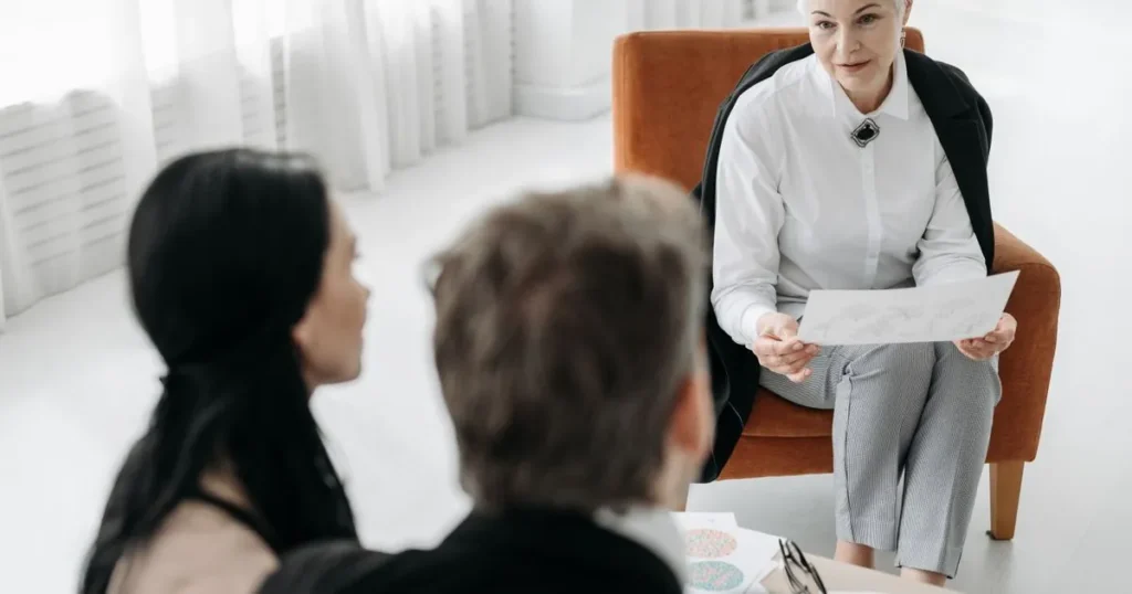 Couple discussing the best debt relief options in Canada with a specialist