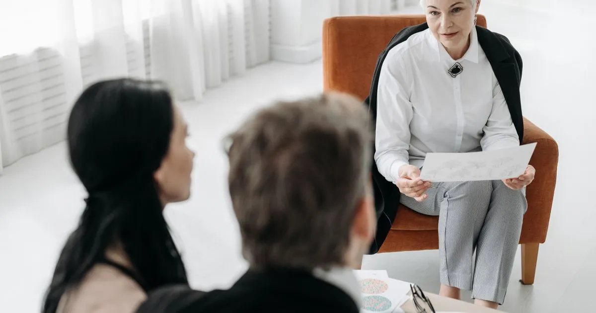 Couple discussing the best debt relief options in Canada with a specialist