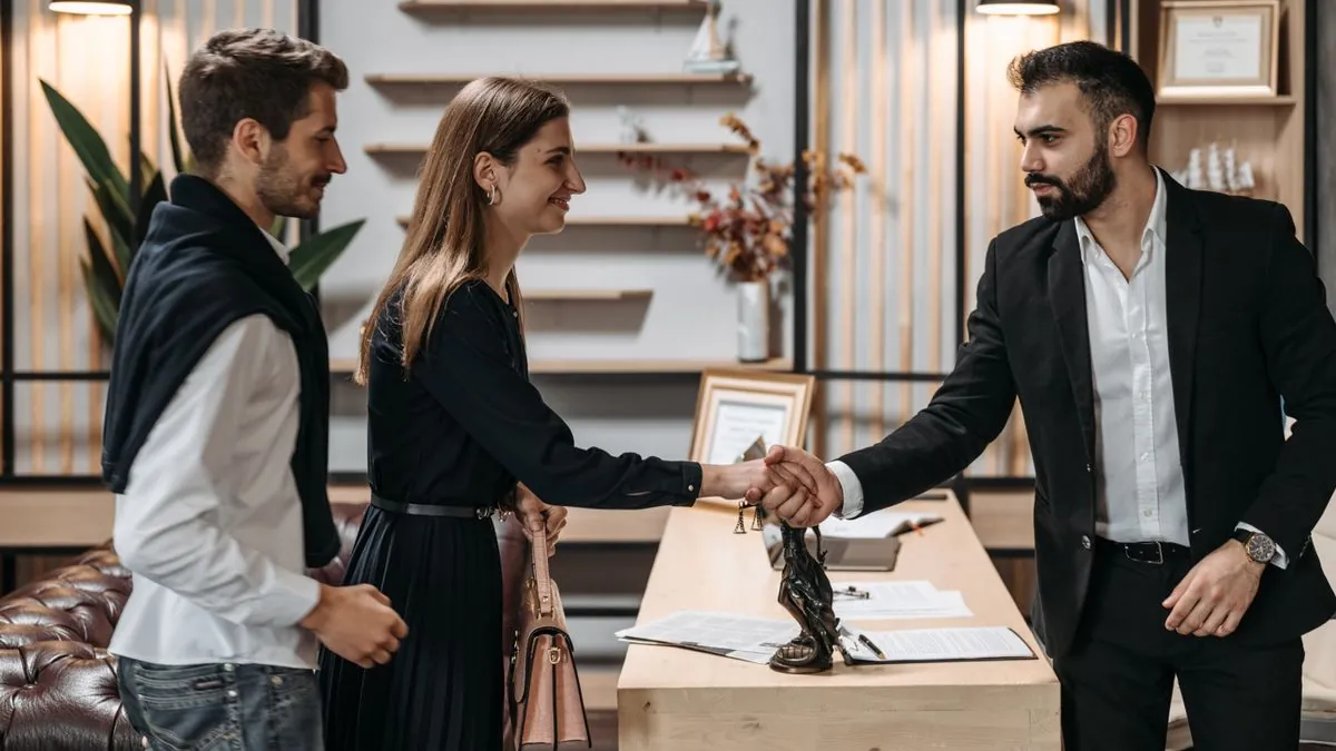 Couple meeting a licensed professional while choosing the best debt relief company