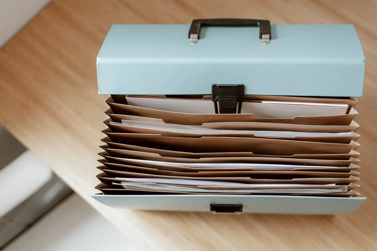 Organized file of debt collection records and letters in Canada