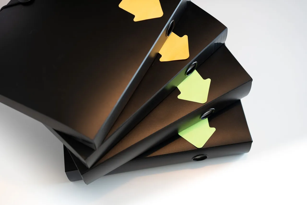 Binders organizing an estate's debts and accounts