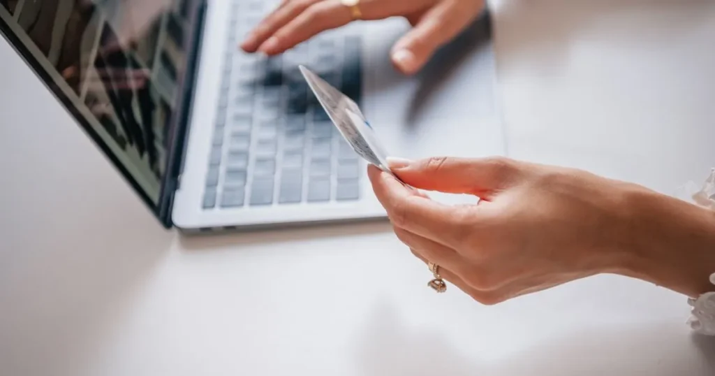 Mastercards for bad credit in Canada - comparing a card at the laptop before applying