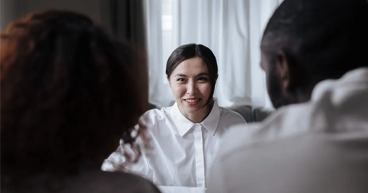 Couple meeting a Licensed Insolvency Trustee to talk through a consumer proposal