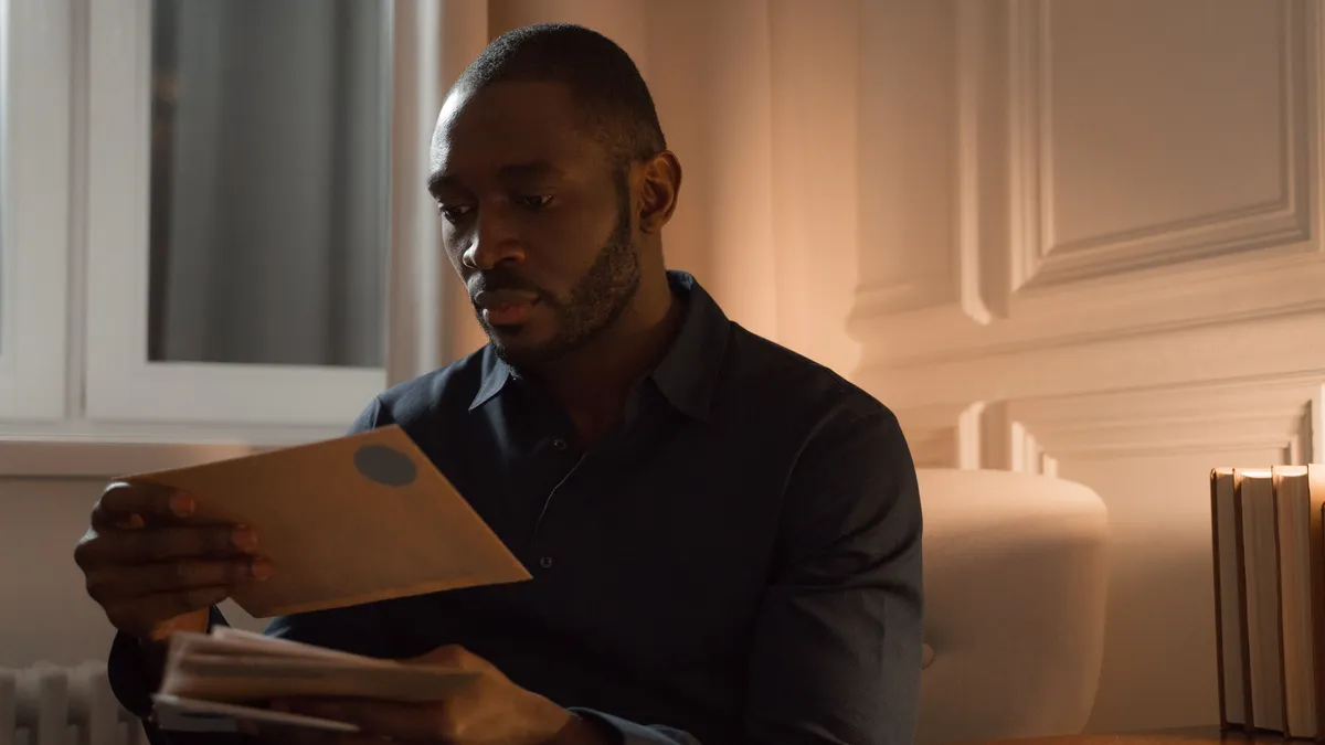 Man reading the result letter from a credit bureau about his credit repair dispute in Canada