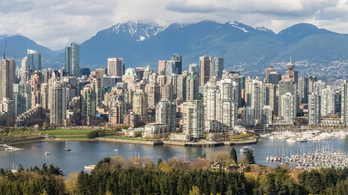 Vancouver skyline and the North Shore mountains, in a province where credit repair Canada rules are set by Consumer Protection BC